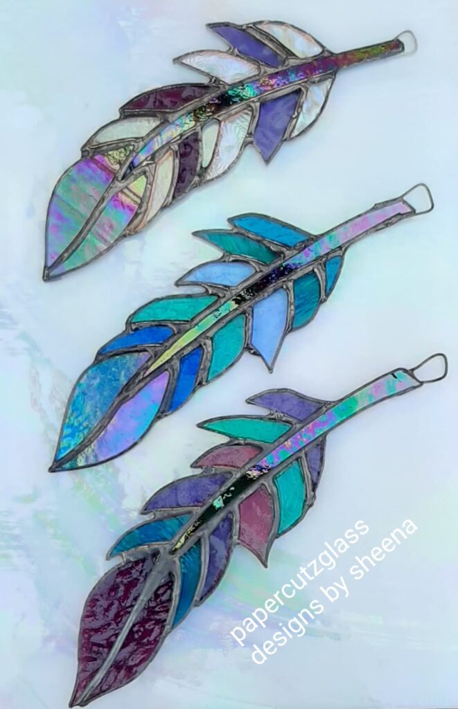 Paper Cutz Glass Feathers. Miss Ivy Events the leading event management organiser of vintage artisan lifestyle wedding and pet events across the South West